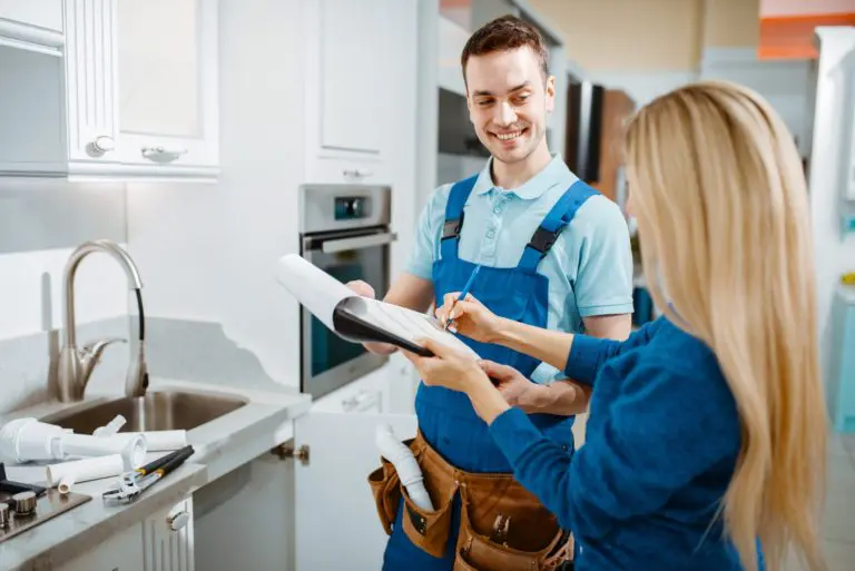 ProResults plumber helping a homeowner in her kitchen
