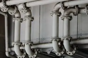 Grayscale industrial metal pipes - Kitec plumbing pipes found in Oakville homes built 1995 to 2007