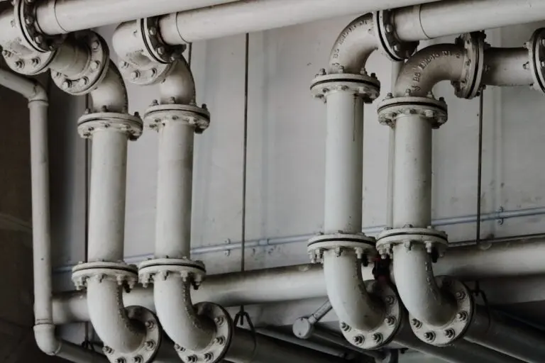 Grayscale industrial metal pipes - Kitec plumbing pipes found in Oakville homes built 1995 to 2007