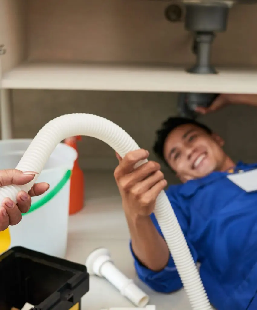 woman-giving-plastic-pipe-to-plumber.jpg